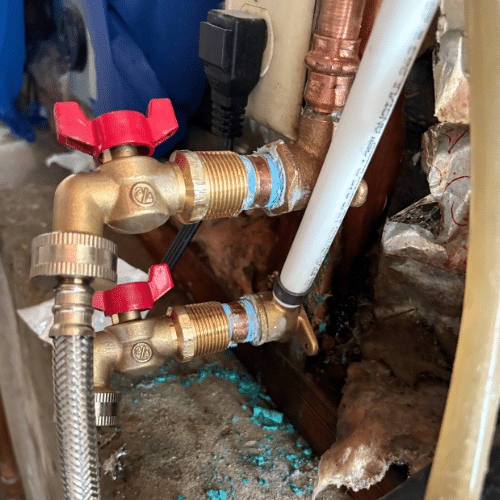 New quarter turn ball valves installed for basement leak repair in Sandy, Utah.