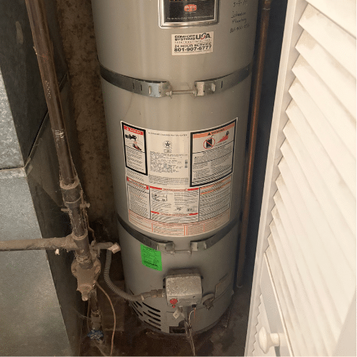 Old water heater before replacement in Taylorsville home