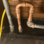 Outdoor hose bib installation on a brick home in Sugar House, Utah. Brass spigot with clean threading, mounted securely to siding.