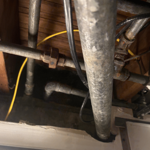 Outdoor hose bib installation on a brick home in Sugar House, Utah. Brass spigot with clean threading, mounted securely to siding.