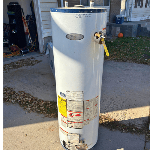 Code-compliant seismic strapping on a new water heater in West Valley City.