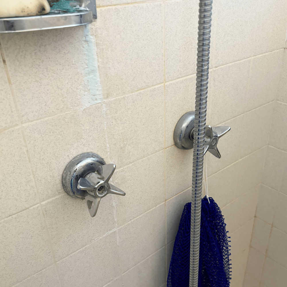 Failed shower valve stems removed during a completed shower repair in Midvale, Utah