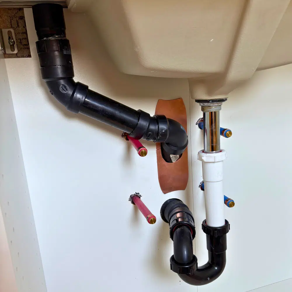 Completed drain and P-trap installation under Salt Lake City bathroom sink