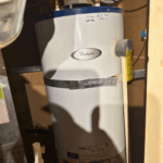 Code-compliant seismic strapping on a new water heater in West Valley City.