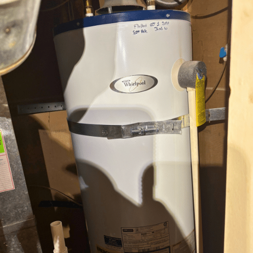 Code-compliant seismic strapping on a new water heater in West Valley City.