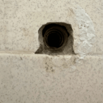 Failed shower valve stems removed during a completed shower repair in Midvale, Utah