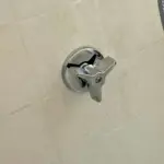 Failed shower valve stems removed during a completed shower repair in Midvale, Utah