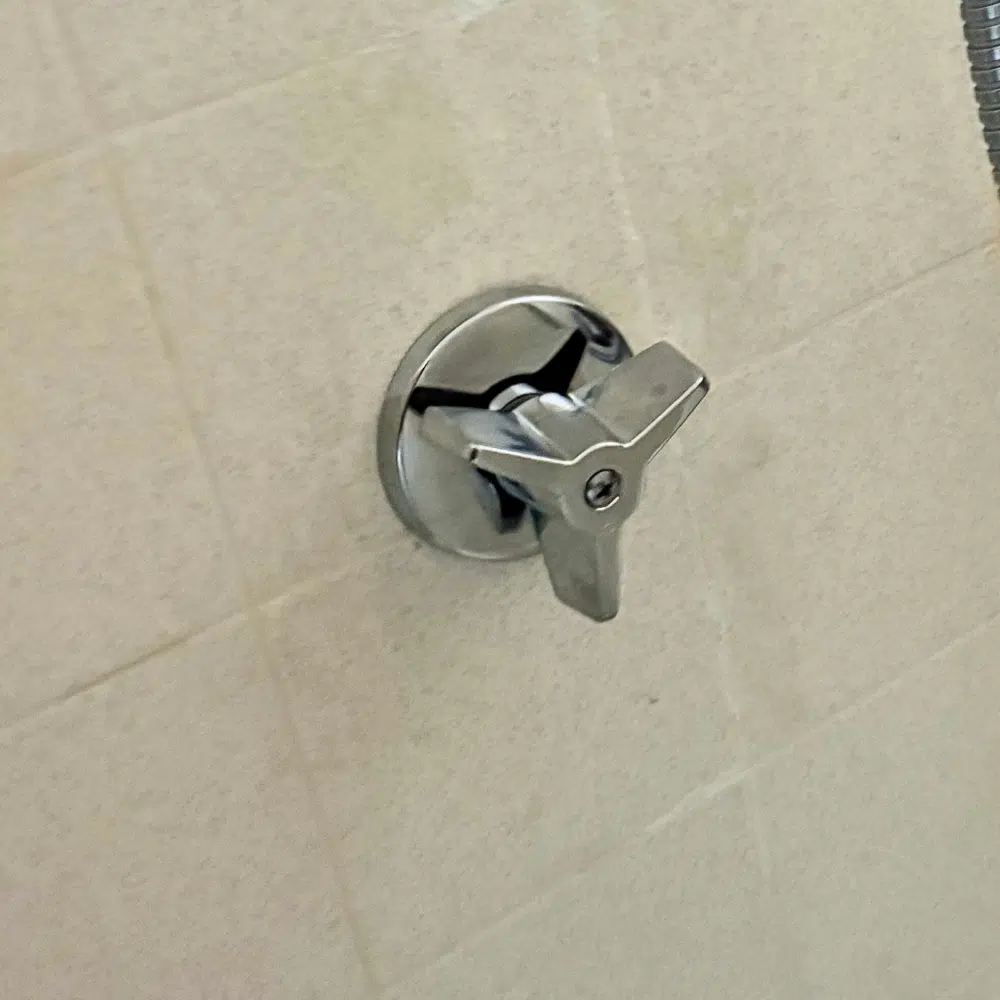Failed shower valve stems removed during a completed shower repair in Midvale, Utah