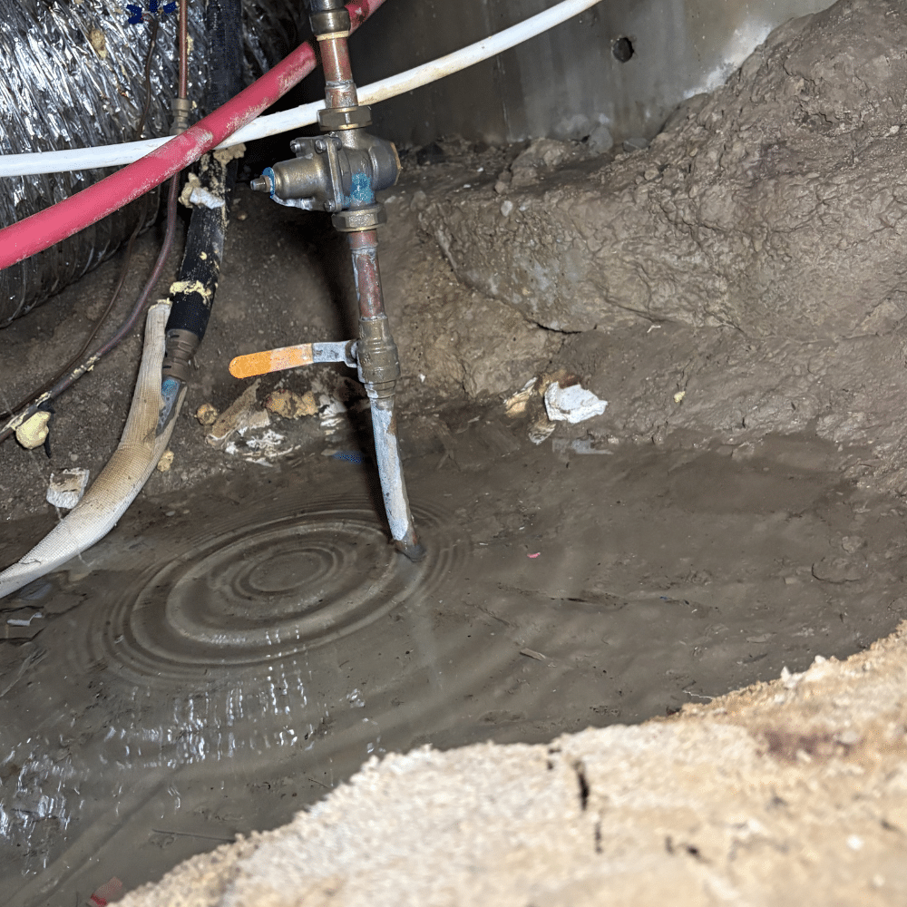 Crawlspace access during a completed PEX leak repair in Murray, Utah
