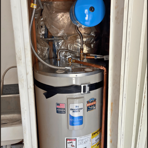 Bradford White electric water heater featuring Mountain Man Plumbing badge, Salt Lake City installation.