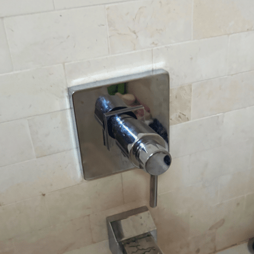 Salt Lake City shower repair inspecting damaged shower valve before replacement