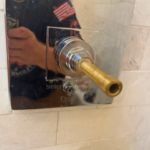Salt Lake City shower repair inspecting damaged shower valve before replacement