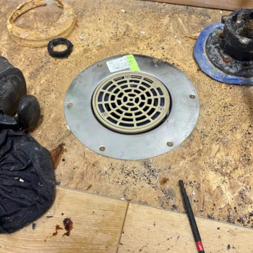 New floor drain and grate installed in Sandy home