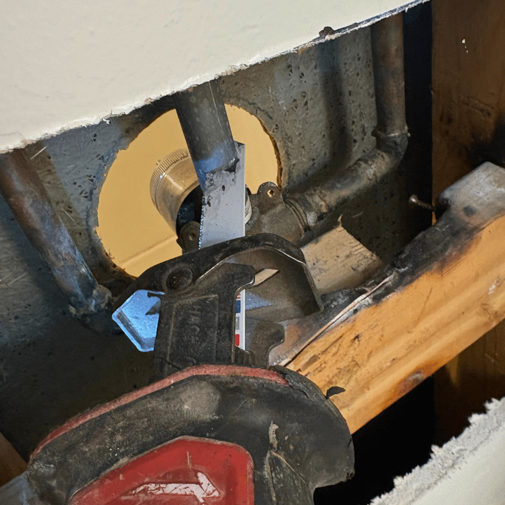 Sealing and finishing repaired shower handle trim during a shower repair in Sandy Utah