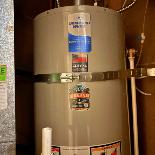 Code-compliant seismic strapping on a new water heater in West Valley City.