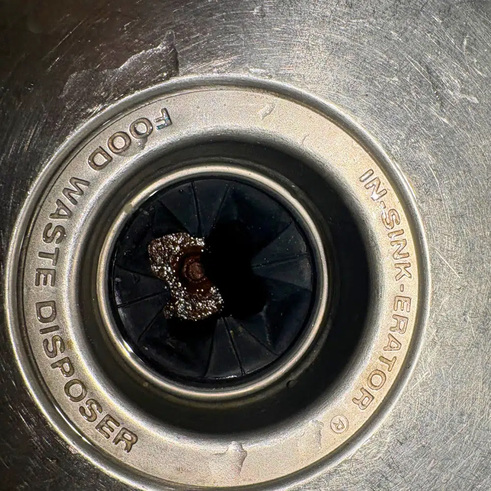 Garbage disposal installation under kitchen sink in West Valley City Utah
