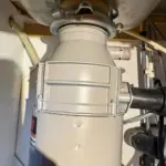 Garbage disposal installation under kitchen sink in West Valley City Utah