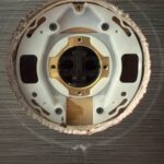Kohler shower valve body in Sandy with cartridge removed, brass retainer and ports visible after balance spool failure.