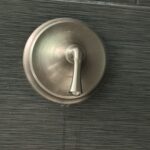 Close-up of Kohler single-handle shower control with hot cold markings after repair in Sandy Utah.