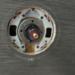 Open Kohler single-handle shower valve in Sandy UT showing cartridge stem and balance area during replacement work.