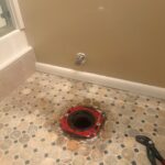 Reinforced flange with closet bolts ready and wall shutoff in place before setting the toilet in West Jordan