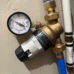 Caleffi 3/4 inch pressure reducing valve with integrated gauge on blue PEX after PRV replacement in North Salt Lake