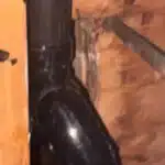 New black ABS P-trap installed under tub framing after drain rebuild in Salt Lake City home