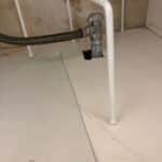 New chrome angle stop shutoff valve with braided supply line on a vanity stub-out