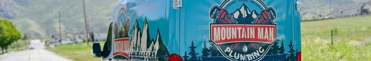 Mountain Man Plumbing service van parked in a scenic mountain landscape near Salt Lake City